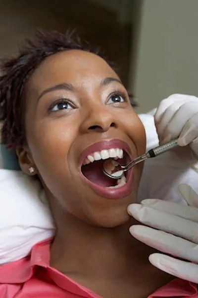 patient getting a dental checkup at Dulce Dental Dallas in Dallas, TX